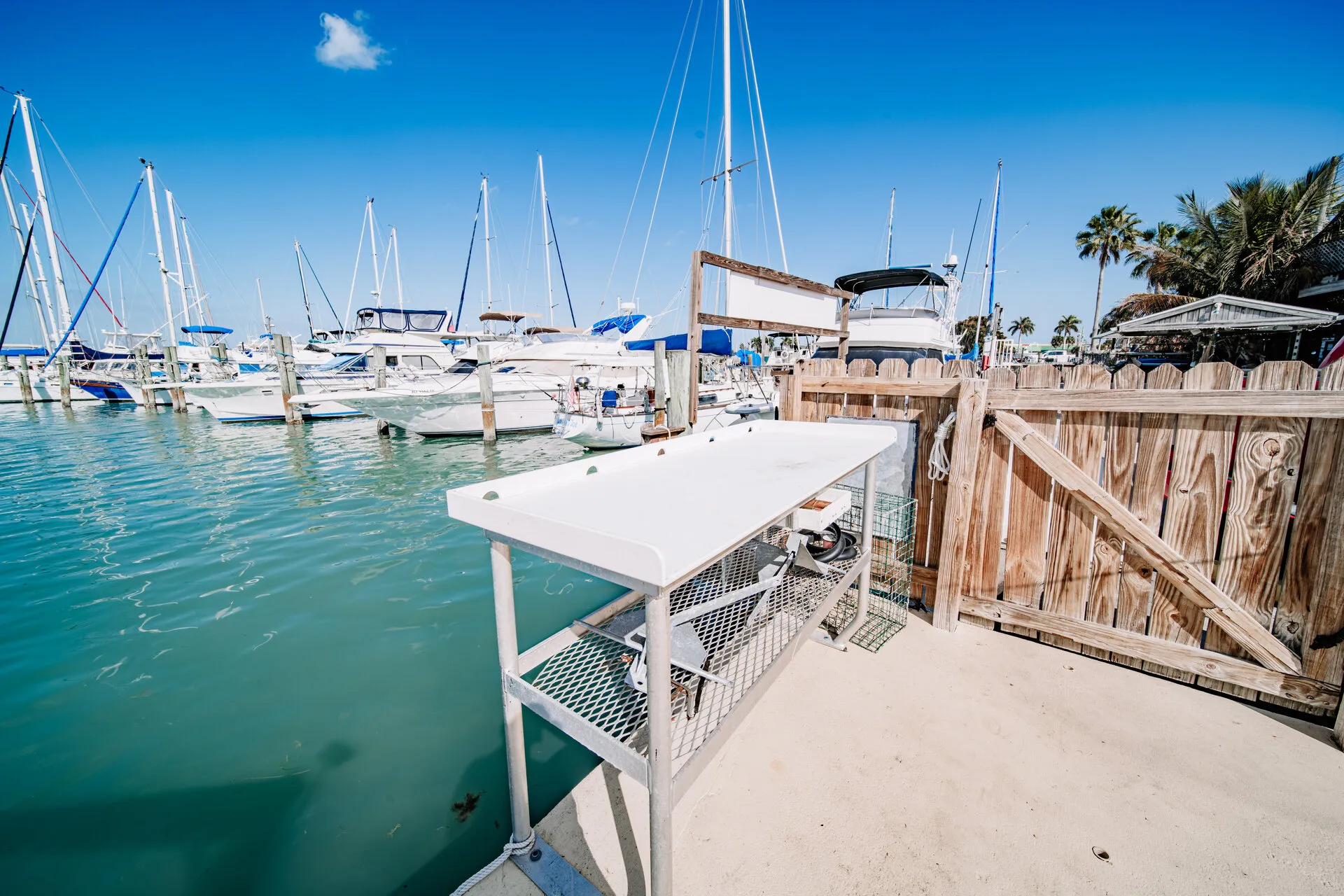 Dock and fish-cleaning station at the Fort Pierce City Marina beside the Compass Boat Club pool house